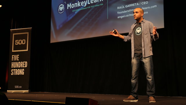 Person on stage duringMonkeyLearn and Zendesk conference