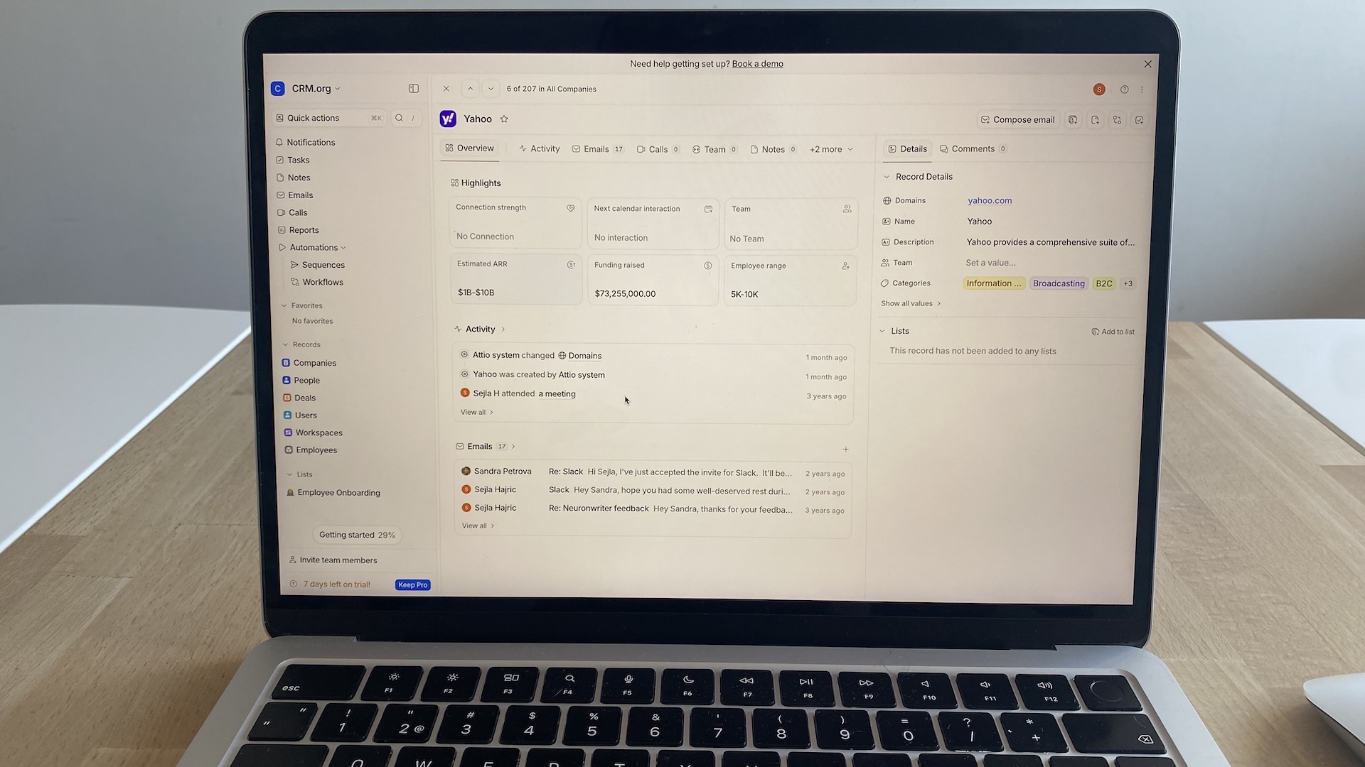 Attio CRM company record showing revenue range, funding data, employee size, recent activity, and linked emails in a single view.