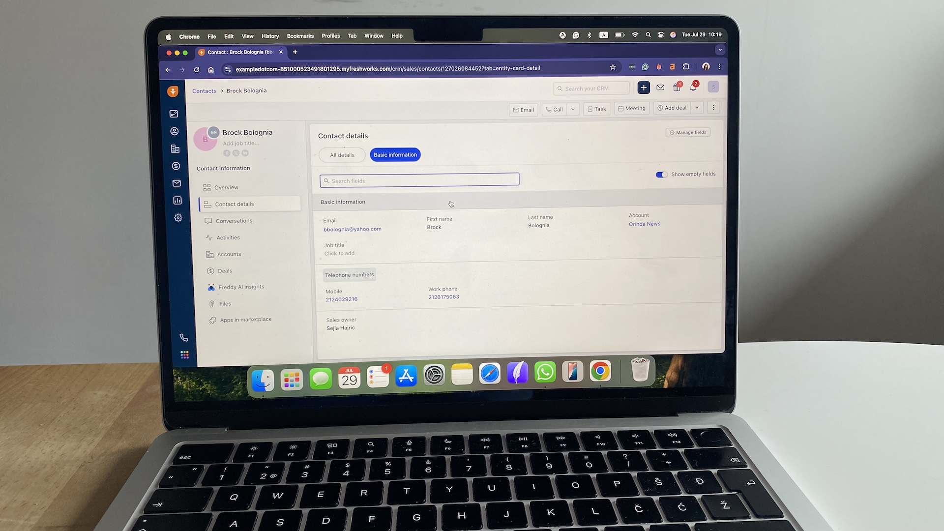 Freshsales contact details screen showing basic information fields like email, phone numbers, and account name.