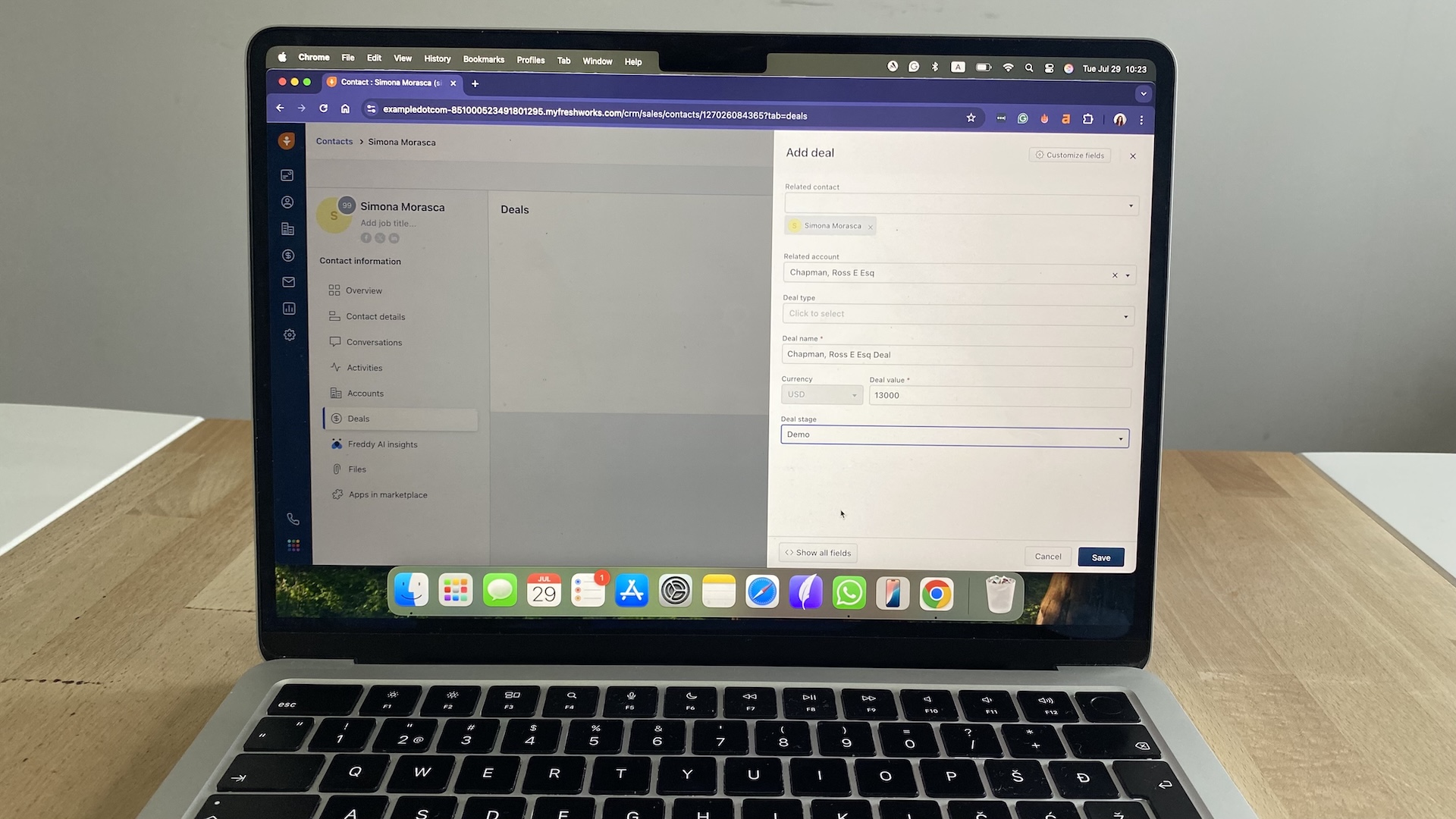 Freshsales add deal form with fields for deal name, value, currency, stage, and related contact.