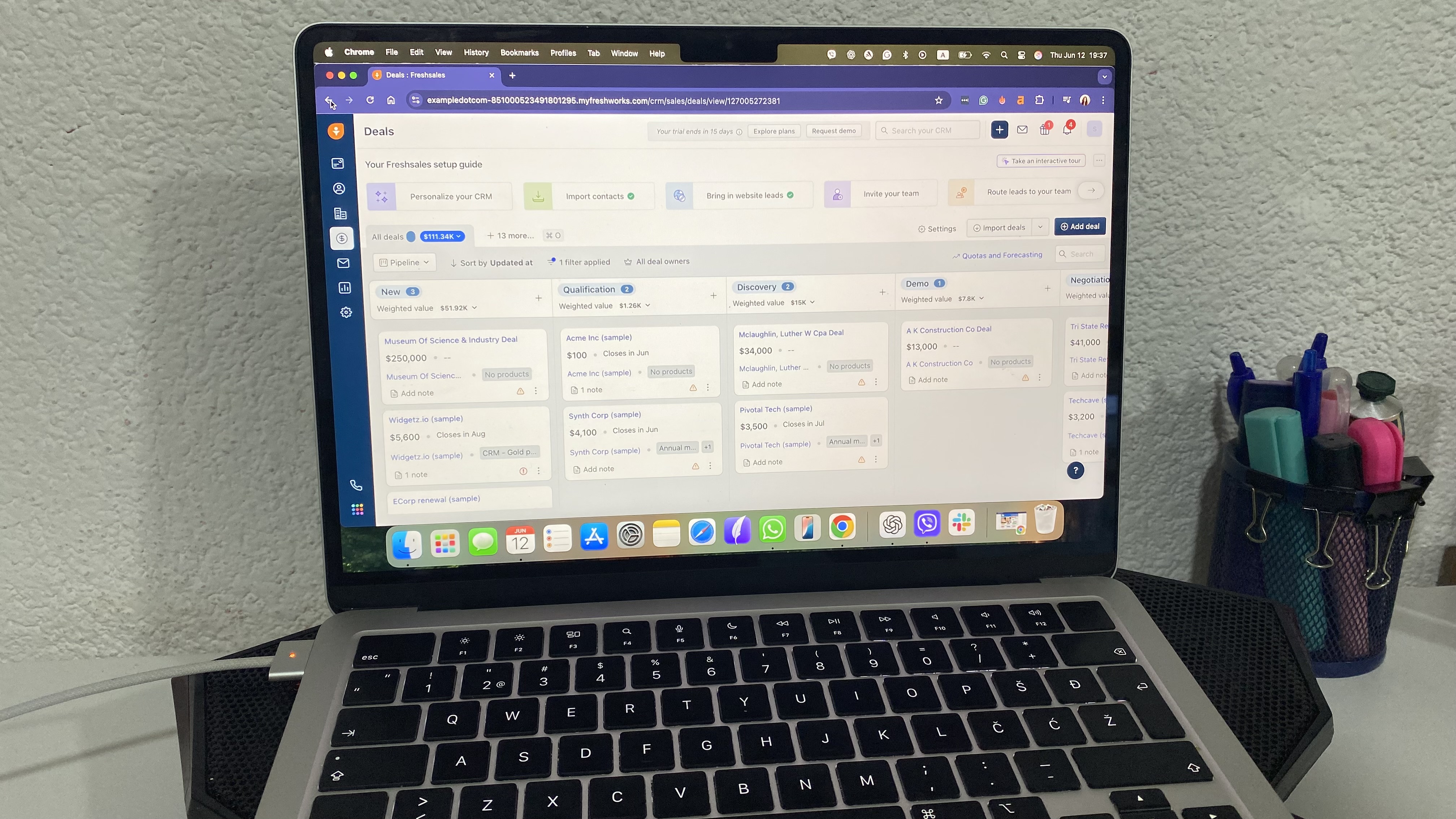 Freshsales CRM kanban pipeline with deal cards organized by sales stage, value, and expected close date