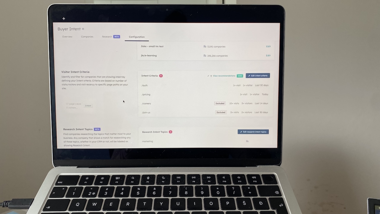 HubSpot Breeze AI showing buyer intent configuration, including visitor and research intent settings.