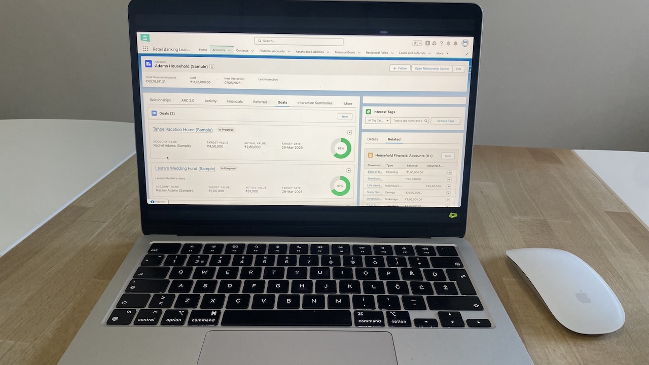 Salesforce Financial Services Cloud account view showing goals, financial accounts, and related household data.