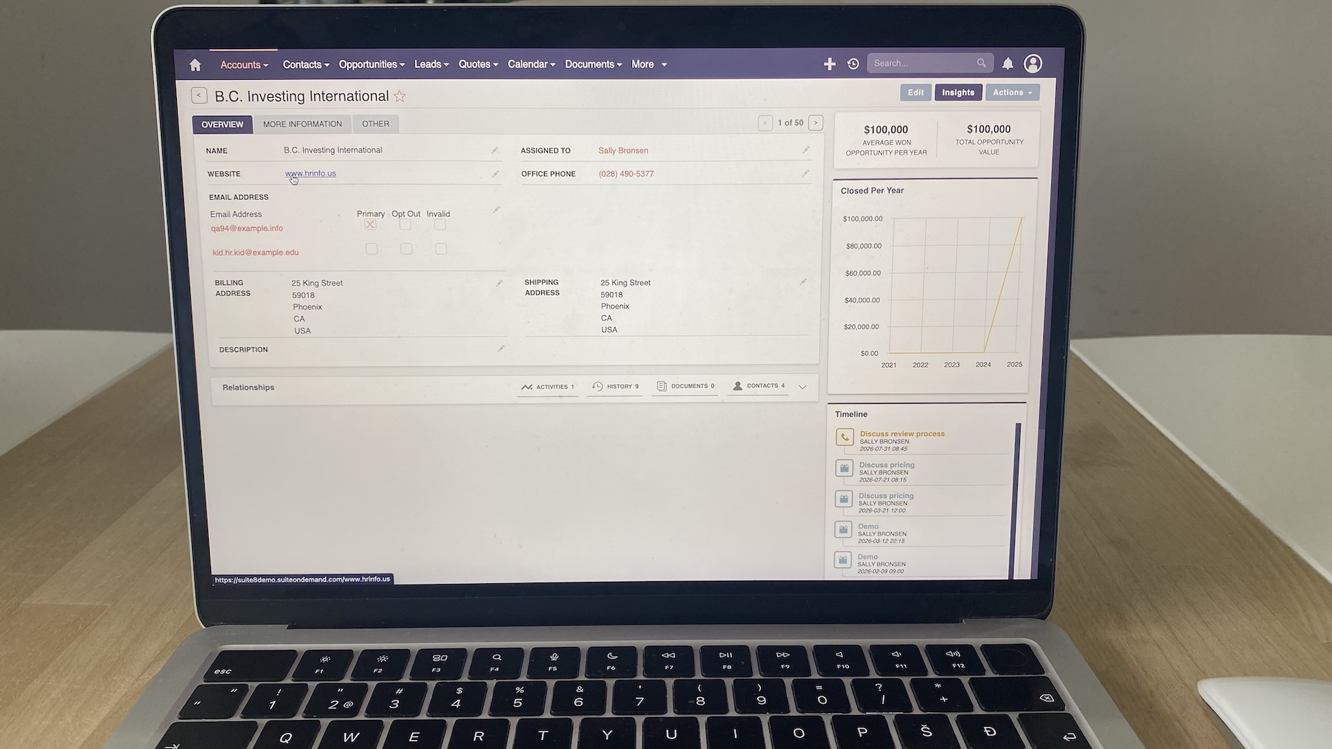 SuiteCRM account record showing company details, assigned user, timeline of interactions, and insights on opportunity value.