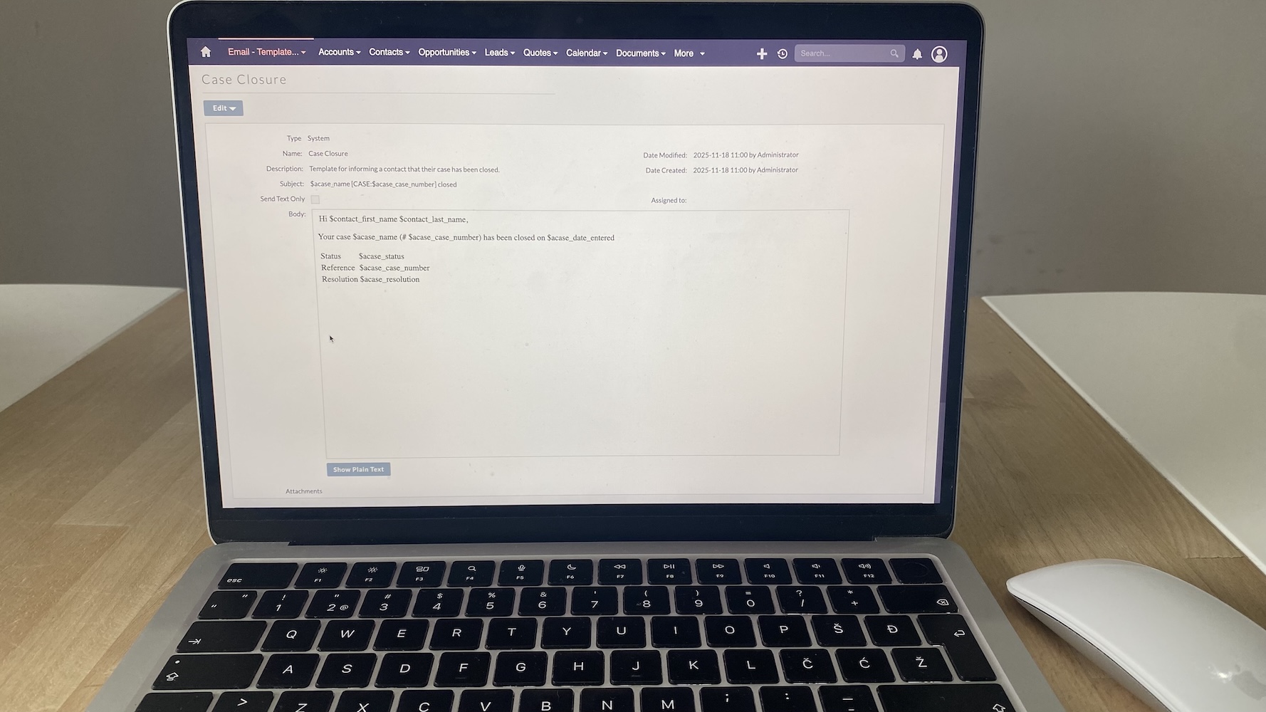System-generated email template in SuiteCRM for case closure, showing merge tags for case details and contact information.