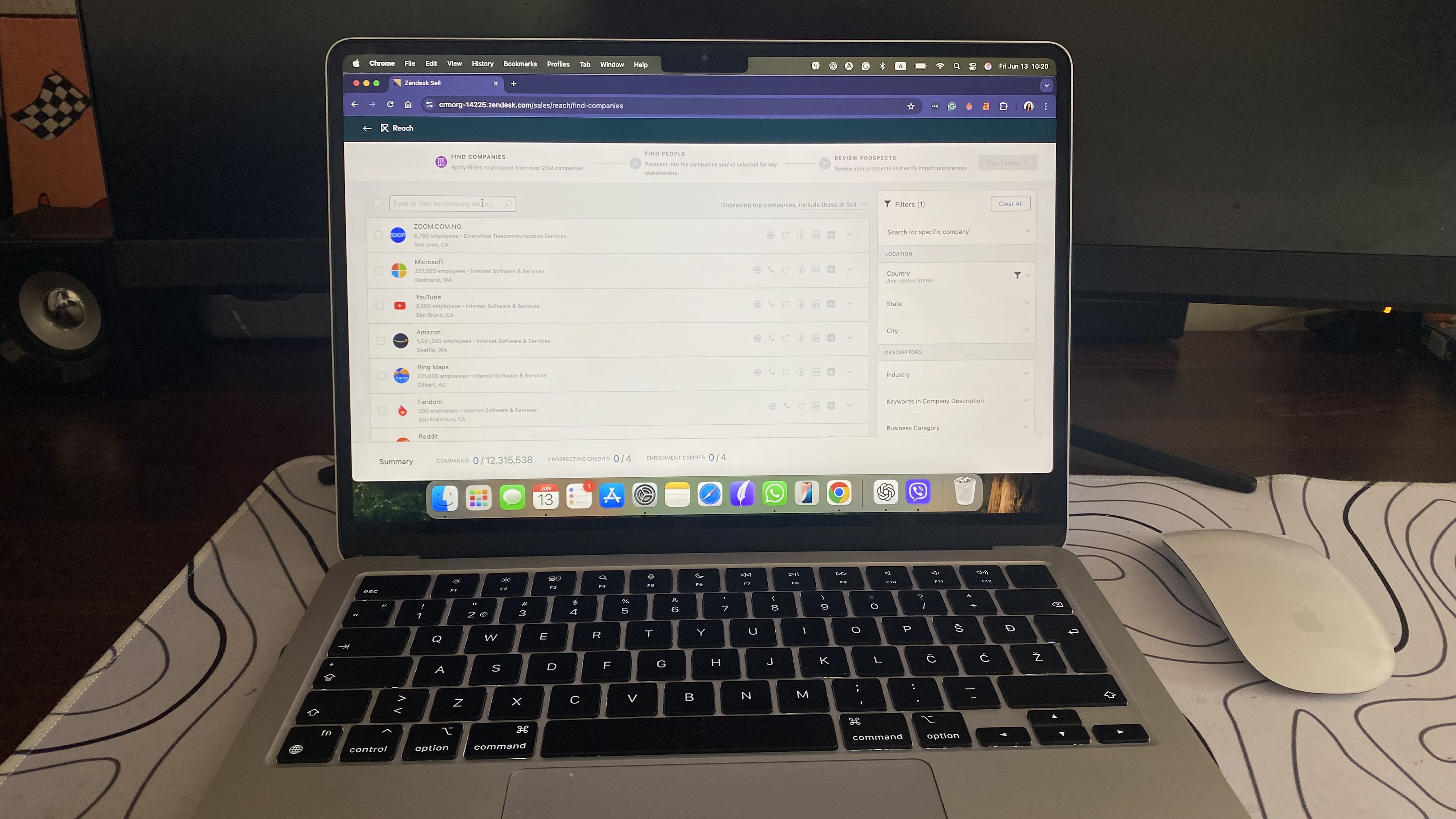 Zendesk Sell Reach interface showing a list of prospect companies with filters and data from Clearbit