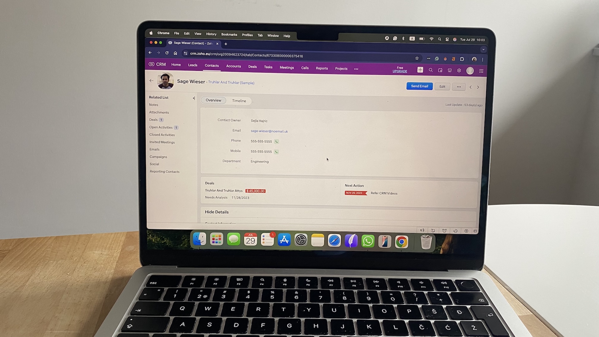 Zoho CRM contact profile showing personal details, related deals, open activities, and upcoming tasks.